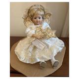 Vintage blonde angel sitting porcelain doll