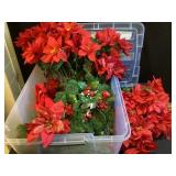 Tote of artificial flowers and greenery