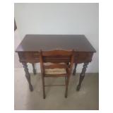 Wooden desk with wicker chair