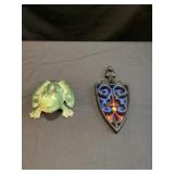 Cast iron, frog, and cast-iron trivet
