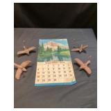 Vintage calendar and vintage cast-iron birds