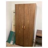 Large wooden cabinet also includes ironing board