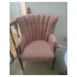 2 pink chairs with wooden legs