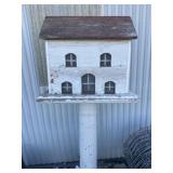 Ornate birdhouse on stand