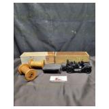 Wooden boxes, spools, and Avon bottle