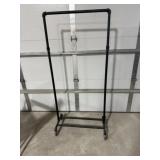 Industrial metal clothing rack on wheels