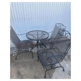 Metal table and three chairs