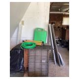 Metal dog crate, hose, and water tank