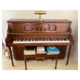 Kimball piano with assorted song books and desk