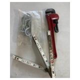 Pipe wrench, folding  ruler, misc
