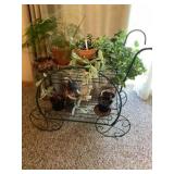 Metal wheelbarrow plant stand