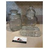 Clear glass candy jars and butter dish