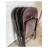 Four metal folding chairs