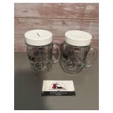 2-  glass mugs coin banks featuring the Bank of