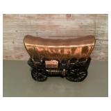 Metal covered wagon coin bank