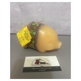 TOPS Malibu Lucky Piggy Bank Candle features a