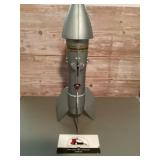 Missile coin bank mechanical bank