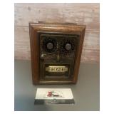 Vintage coin bank crafted from a brass post
