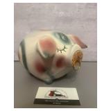 Hull Pottery Corky Pig bank features a