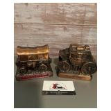 2- Vintage metal coin bank featuring