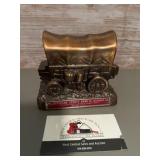 Vintage metal coin bank, featuring