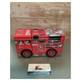 Coca-Cola branded tin fire truck coin bank with