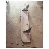 Shelf with metal brackets
