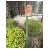Dexter advertising rain gauge mounted to stake