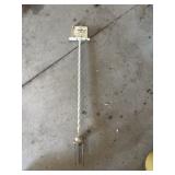 Metal Dexter, IA rain gauge mounted in stake.