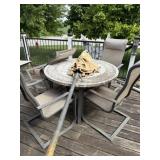 Patio table and chairs and umbrella