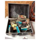 Vintage suitcase with automotive parts