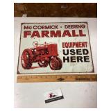 Metal McCormick Farmall equipment sign