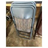 Four padded folding chairs