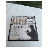 A fisherman lives here sign