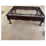 Glass top claw foot coffee table