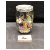 Glass jar and thread spools