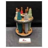 Wooden spool holding wool spools