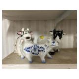 Cow Bank and Two Creamers