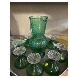 Green glass goblets and pitcher