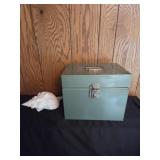 Metal box with assorted items, shell