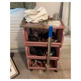 Plastic cart with assorted shoe shine items
