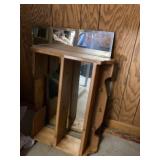 Glass mirror and wooden shelf
