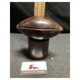 And carved polished ironwood football sculpture