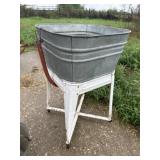 Galvanized wash tub on base
