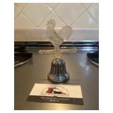 Plastic rooster  on bell