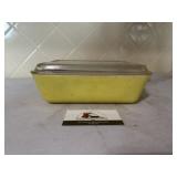 Yellow Pyrex dish with lid