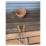 Terra-cotta planter and butterfly wind chime