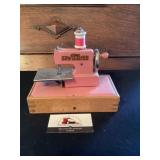 Vintage metal pink toy sewing machine