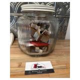 Glass jar of cookie cutters
