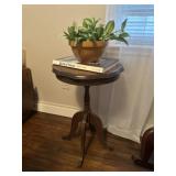 Wooden plant stand with book and fake plant